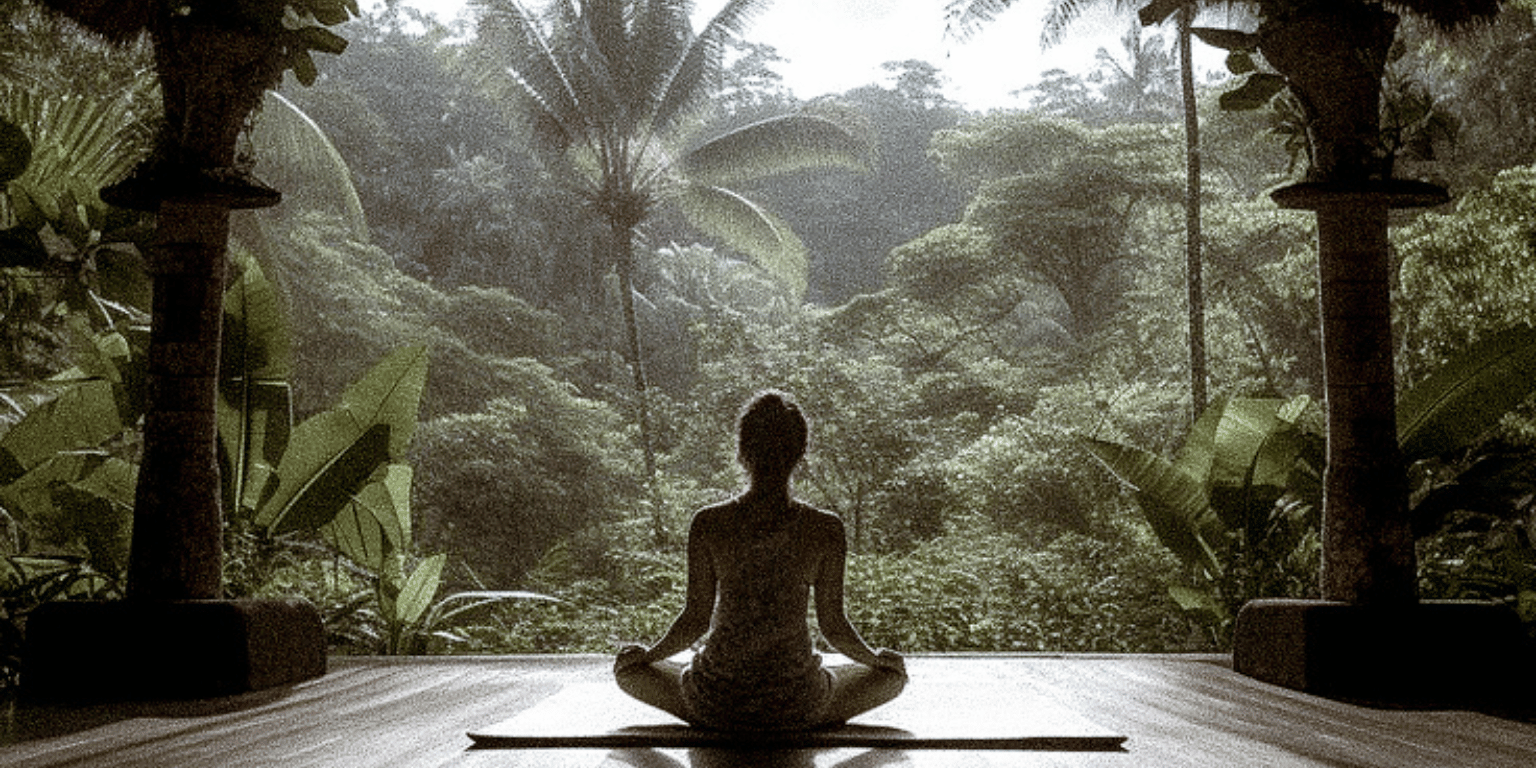 a woman meditating with a forest view